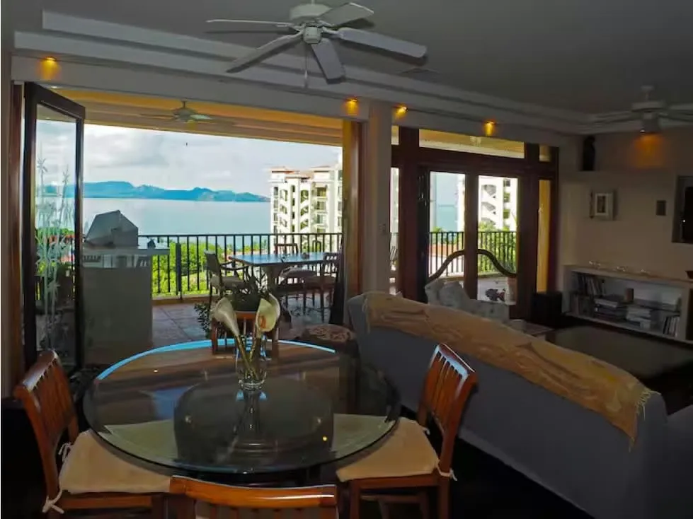 Wake up to breathtaking ocean views from this elegant penthouse, where both bedrooms and all living areas—including ...