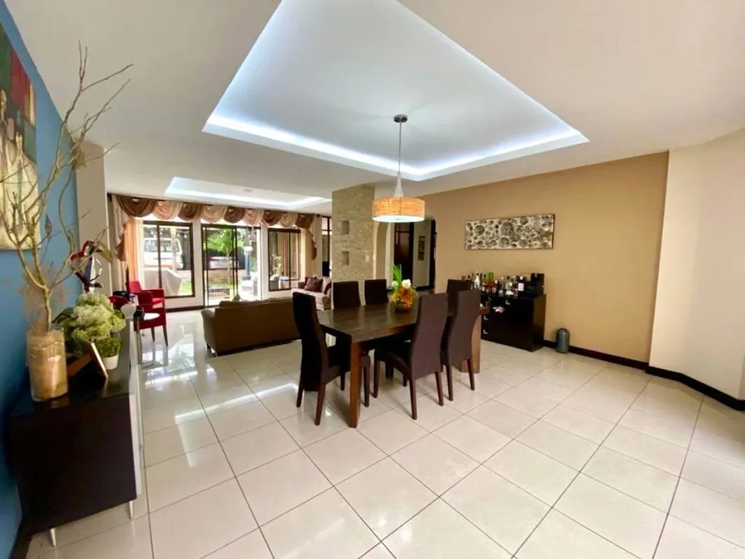Separate, spacious kitchen, with wooden furniture, central island and direct access to the social area.