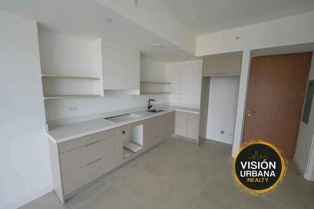 Modern studio apartment with a dividing wall between the living room and bedroom, ideal for those seeking a functional, contemporary, and move-in ready space.