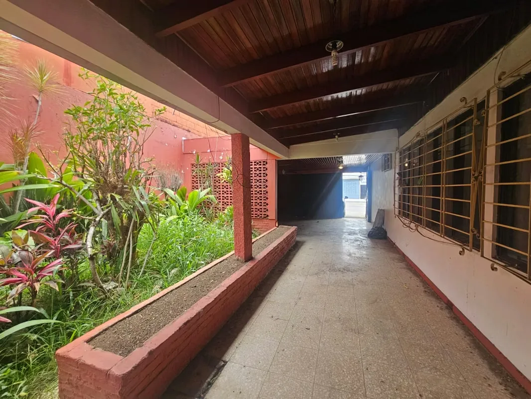 This lot includes a house that is 80% complete and needs to be demolished or remodeled. It has a solid structure.