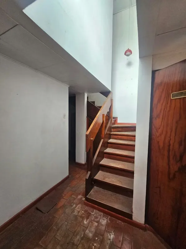 This lot includes a house that is 80% complete and needs to be demolished or remodeled. It has a solid structure. — photo 2