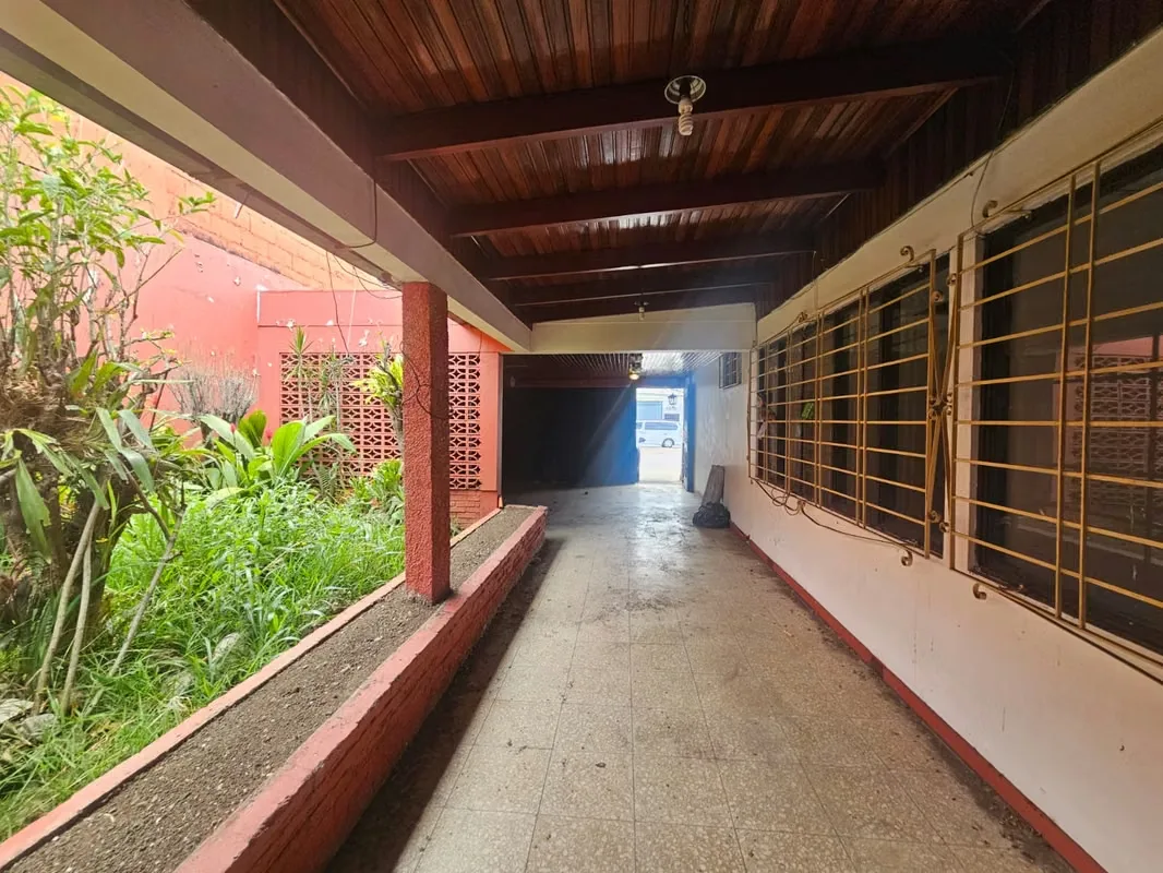 This lot includes a house that is 80% complete and needs to be demolished or remodeled. It has a solid structure. — photo 3