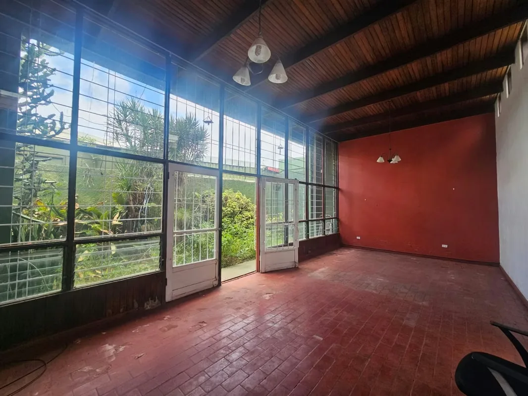 This lot includes a house that is 80% complete and needs to be demolished or remodeled. It has a solid structure. — photo 4