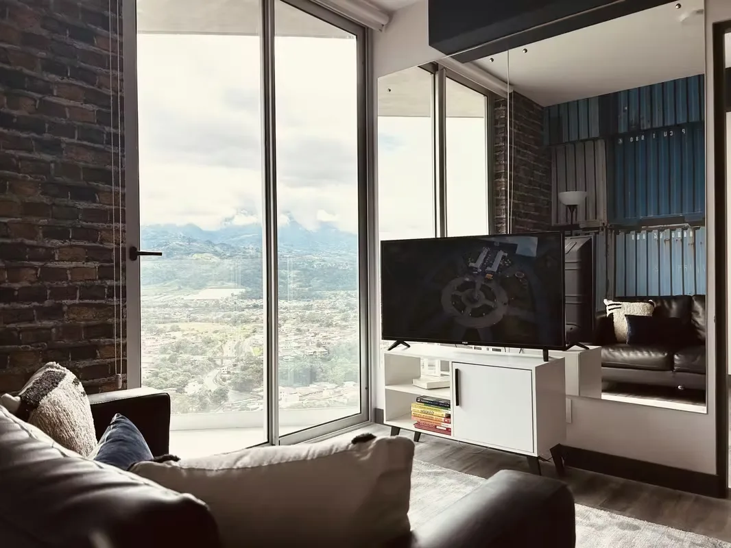 Experience high-rise living and modern design in an exclusive San José condominium. This fully furnished ... — photo 2
