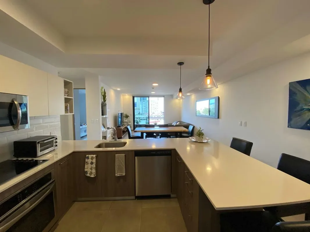 Features two bedrooms: the master includes a spacious walk-in closet and an en-suite ...