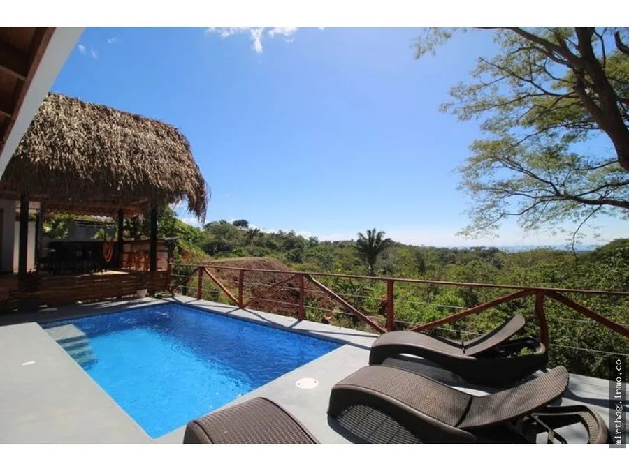 Charming tropical style home with stunning jungle and ocean views