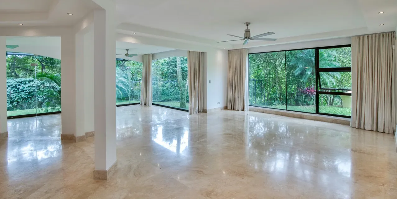 4-bedroom home in Ciudad Colón, Mora with large terrace, canyon views, river sounds, and flexible living spaces in a quiet gated community. Costa Rica