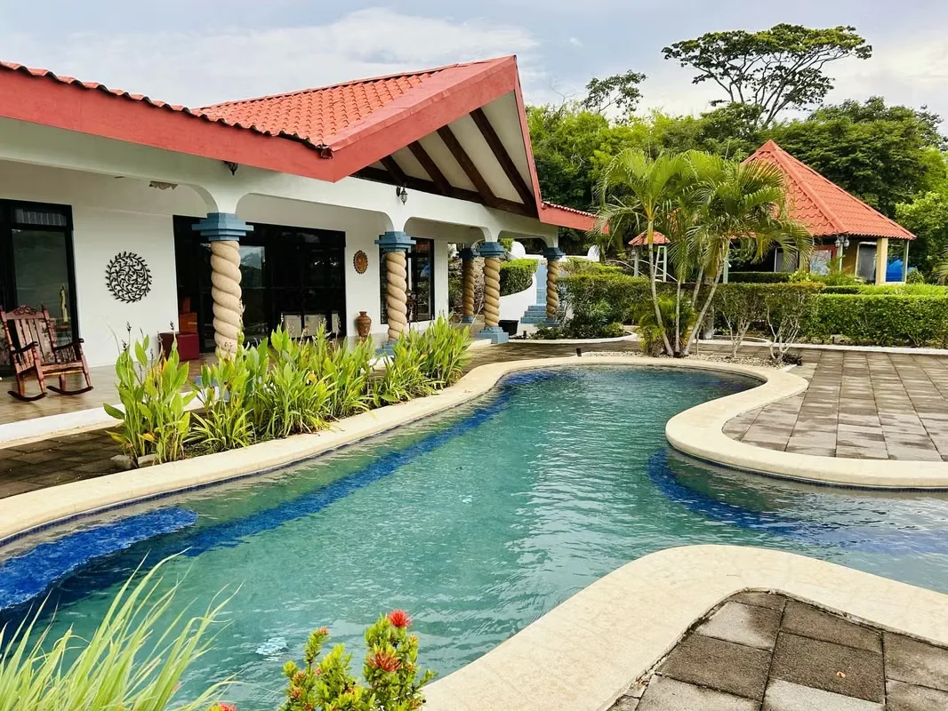Located in the prestigious Pacific Heights development, this beautiful home sits atop the hills overlooking Playa Potrero, just minutes from the world-renowned Flamingo Beach.