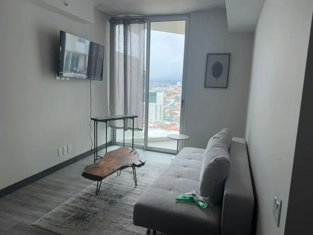 Enjoy contemporary city living in this high-floor 64 m² (688 sq ft) apartment located on the 22nd floor of Secrt Sabana, featuring wall-to-ceiling windows with unobstructed east-facing ...