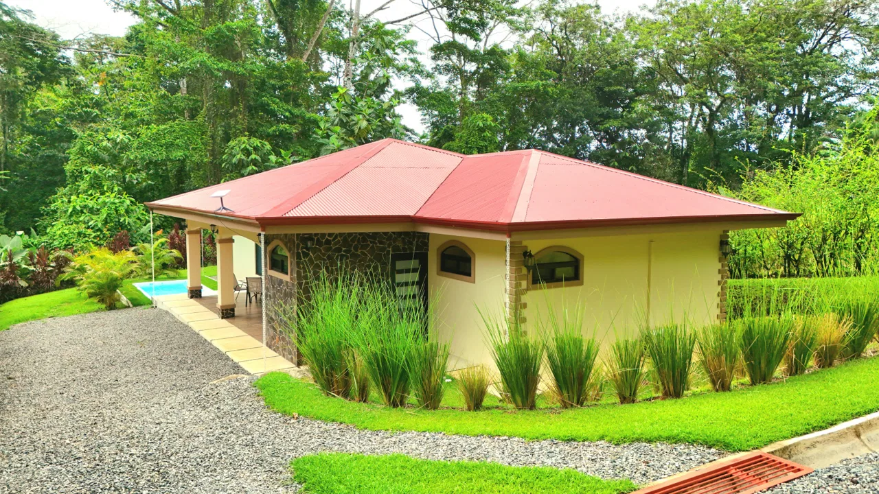 CONTEMPORARY 2-BEDROOM HOME WITH NATURAL SETTING AROUND IN GATED COMMUNITY – 0.22 ACRE