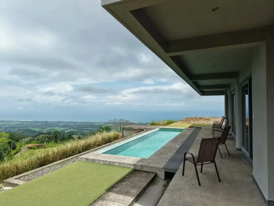 Located 500 meters above sea level in the exclusive Hermosa Hills of Jacó, this stunning 5-bedroom property offers unparalleled luxury and breathtaking mountain views. Built in 2021, ...