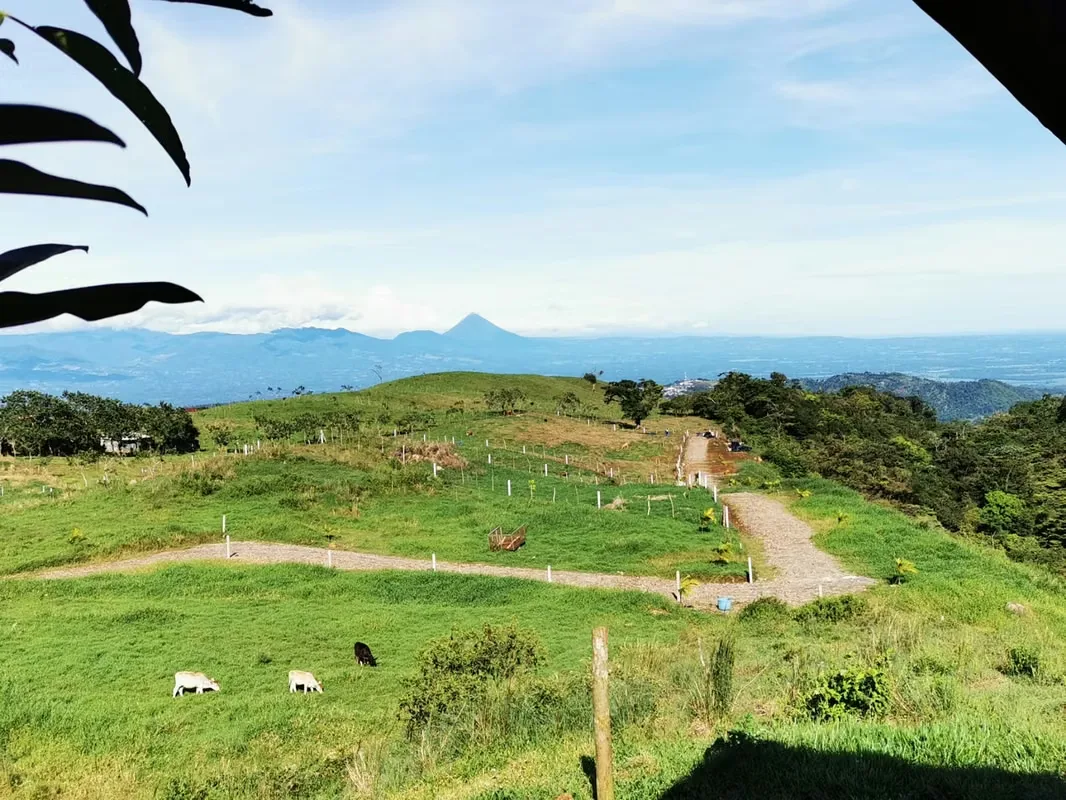Discover Lotes Vistas de San Juan, a residential development surrounded by nature, offering a cool climate, privacy, and breathtaking panoramic views of Arenal Volcano.