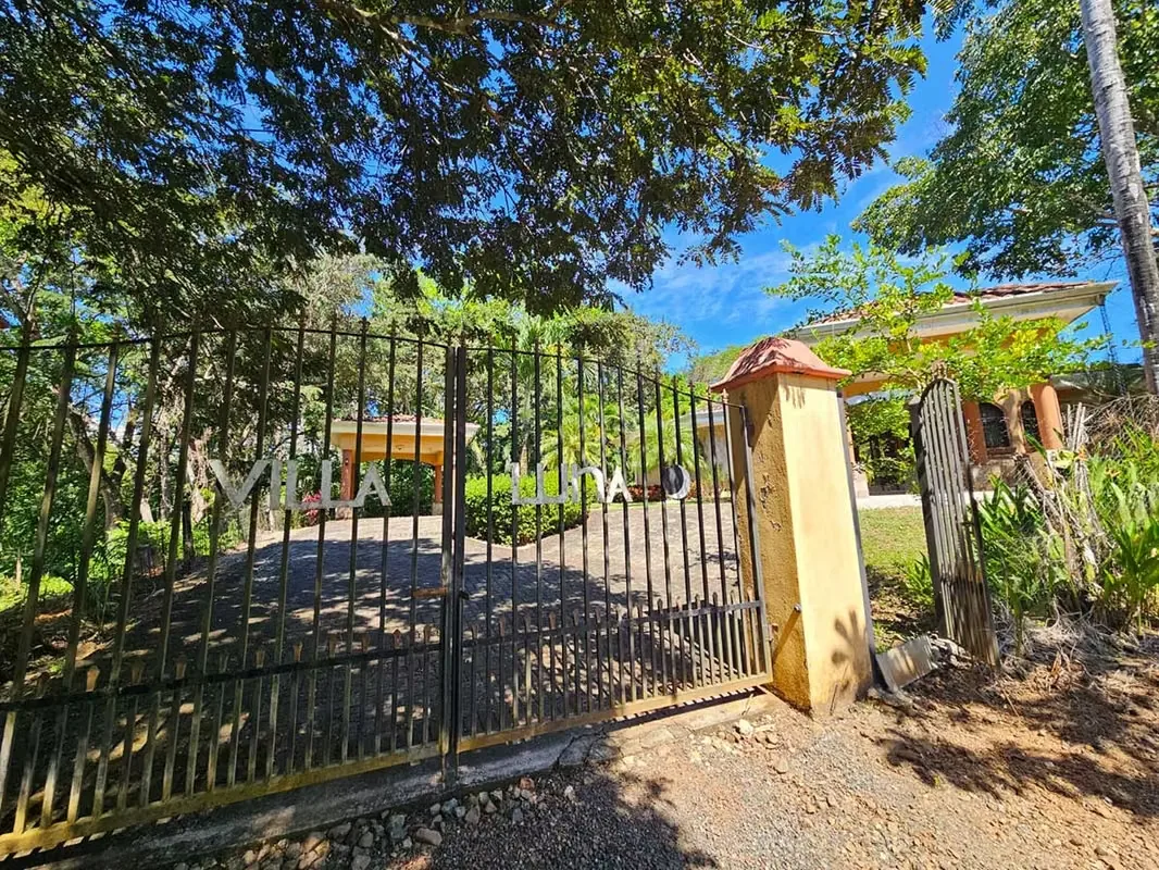 The home welcomes you with a bright open-concept living and dining area, filled with natural light from surrounding windows that frame lush tropical views. The large dining area flows ...