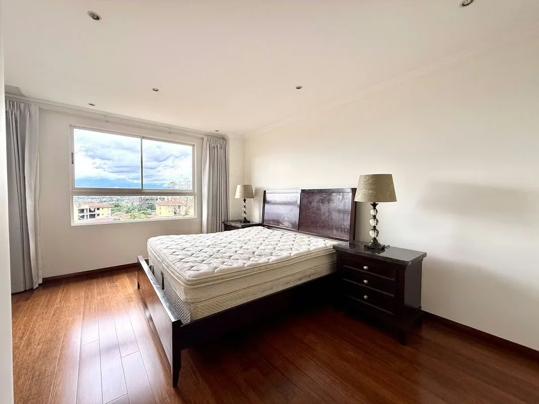 This apartment stands out for its spacious and comfortable layout. The kitchen is integrated into the social area and features a convenient breakfast bar, with direct access to a ..., photo 6