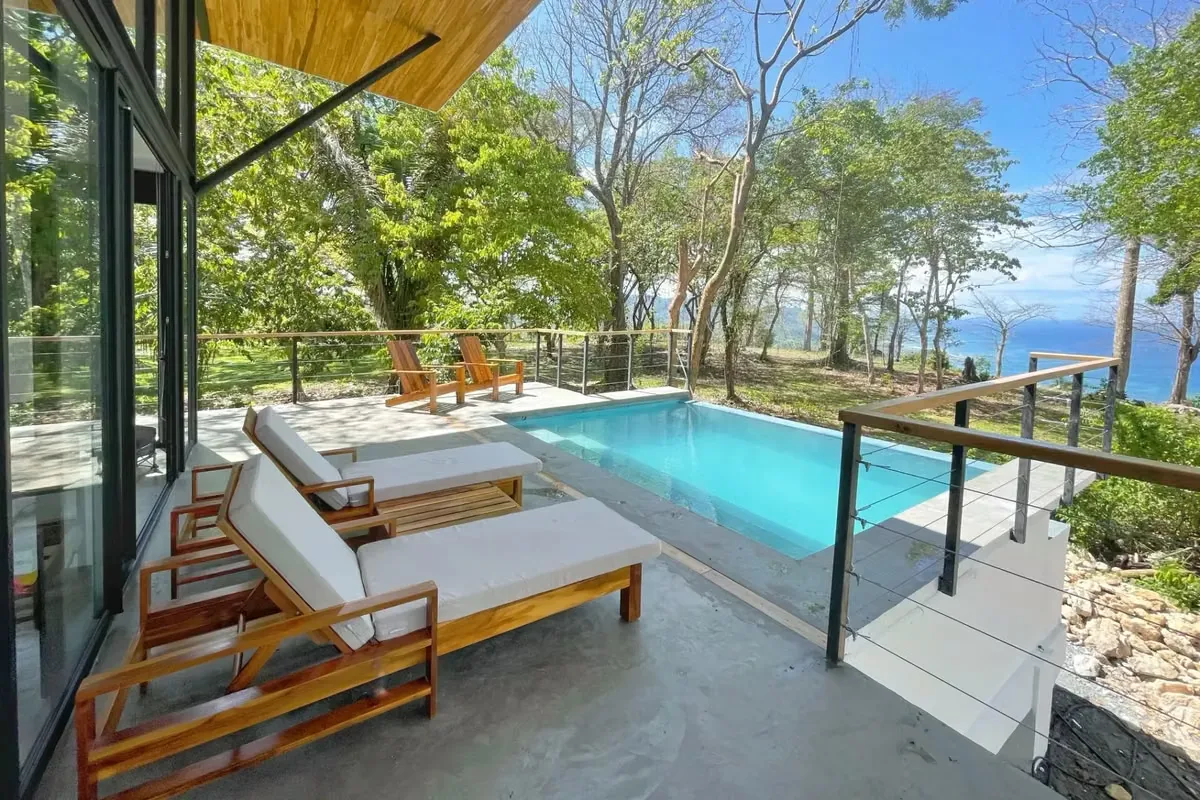 Tucked away behind lush tropical greenery on the highly sought-after Calle Buenos Aires, this contemporary home offers a rare blend of privacy, ocean views, and modern design—one of ...