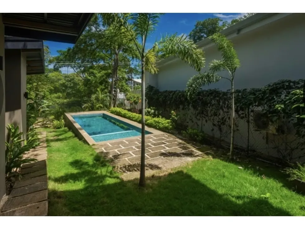 Discover the perfect balance between modern design, tropical comfort, and prime location in this stunning 3-bedroom, 3.5-bathroom home located in the exclusive Tamarindo Park community, ..., photo 9