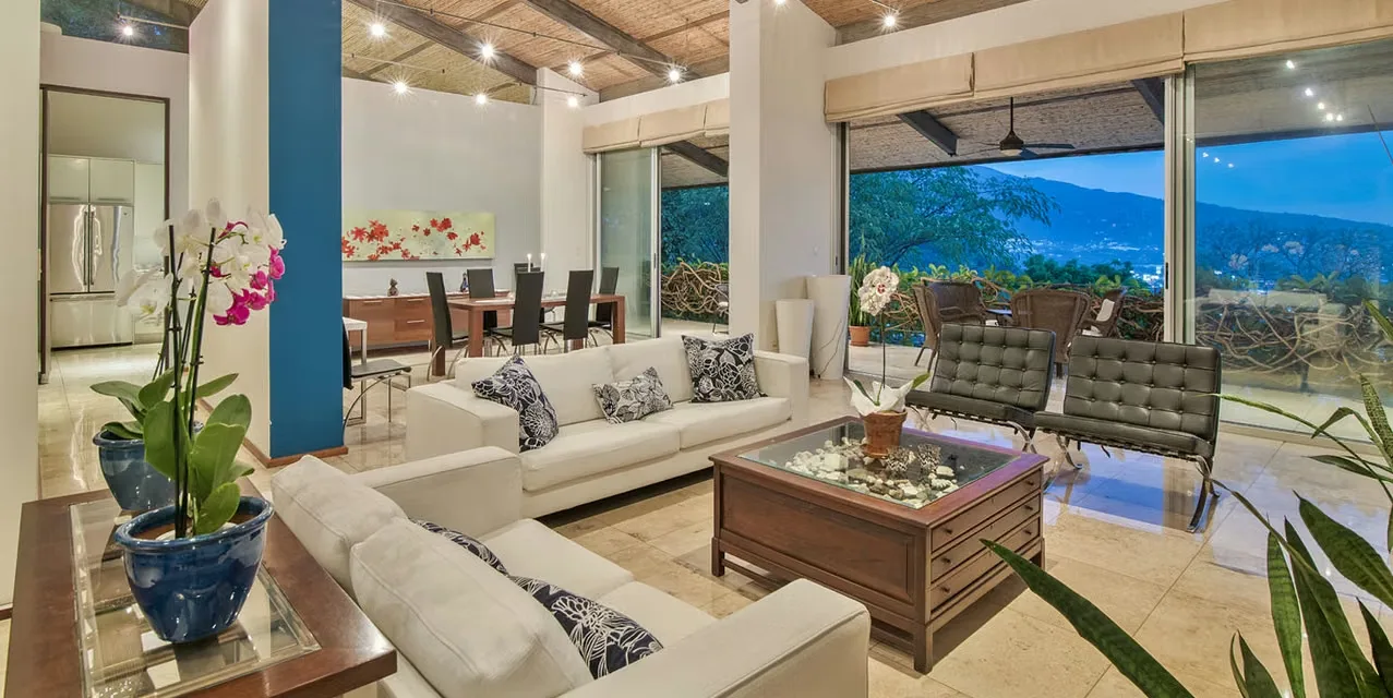 4-bedroom home with office in Villa Real, Santa Ana, featuring solar heated saltwater pool, mountain and sunset views, updated interiors, and spacious terraces. Costa Rica