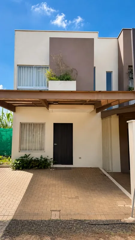 Own a beautiful brand-new home in Santa Bárbara, Heredia, located in a modern gated community just minutes from Juan Santamaría International Airport. The Naala Model 2 features a ...