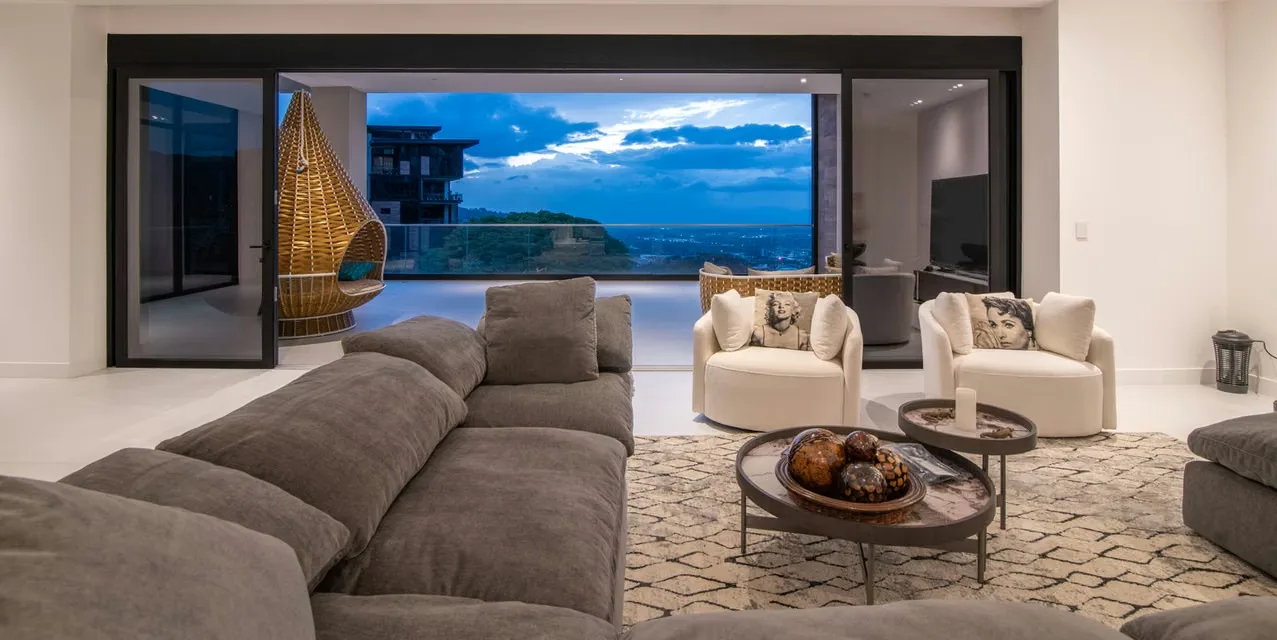 4-bedroom luxury home in Solaris, Santa Ana with private terrace, mountain views, modern kitchen, ensuite bedrooms, and community pool. Costa Rica.