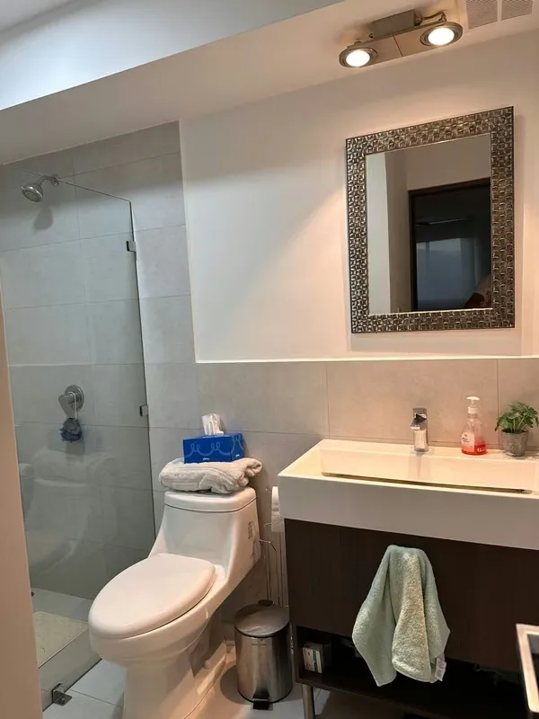 The apartment has a master bedroom with a queen bed, with a full bathroom, reading table, ..., photo 2