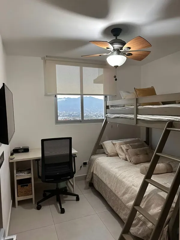 The apartment has a master bedroom with a queen bed, with a full bathroom, reading table, ..., photo 6