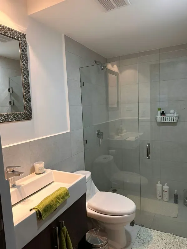 The apartment has a master bedroom with a queen bed, with a full bathroom, reading table, ..., photo 7