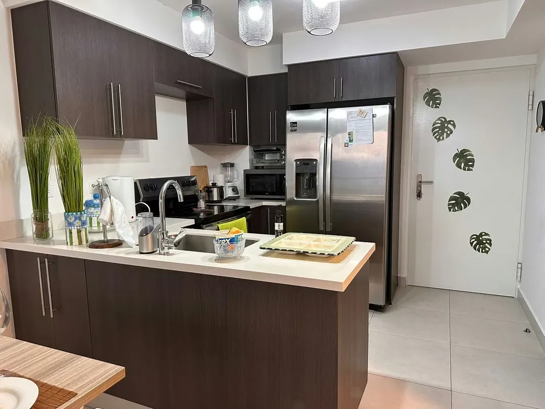 The apartment has a master bedroom with a queen bed, with a full bathroom, reading table, ..., photo 8
