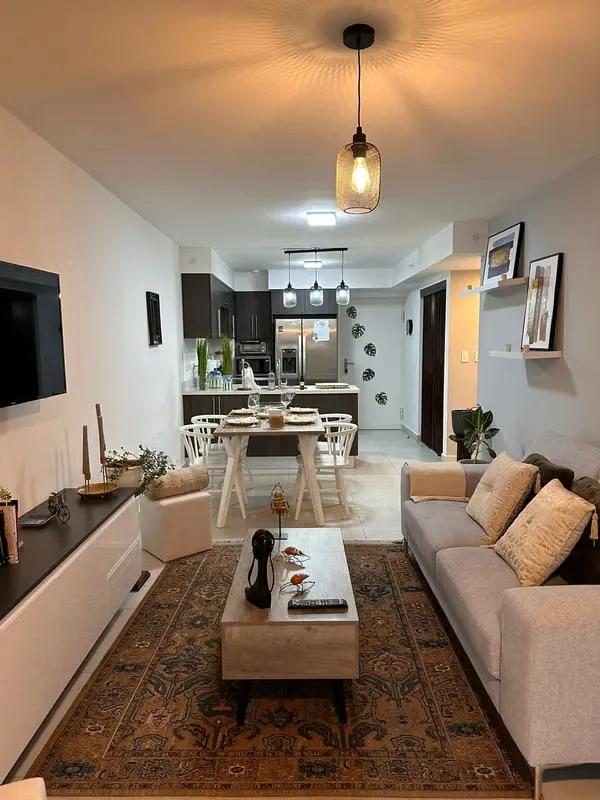 The apartment has a master bedroom with a queen bed, with a full bathroom, reading table, ..., photo 9