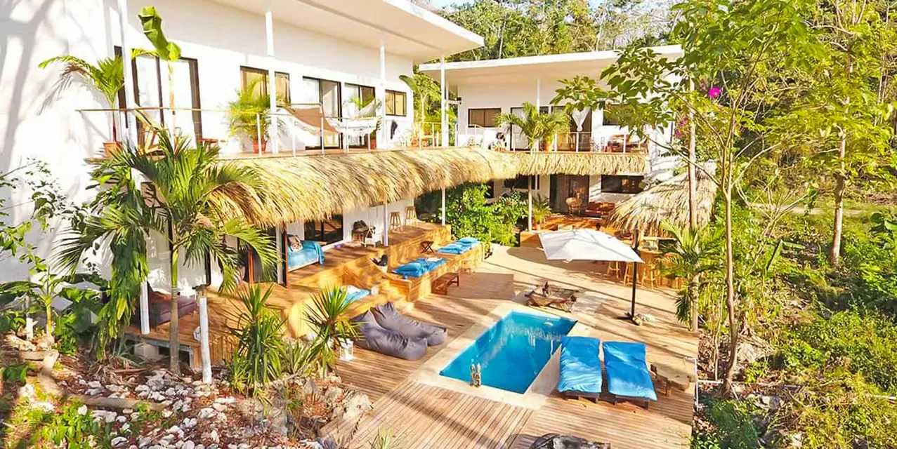 Boutique hotel with 7 bedrooms in Puntarenas, ocean and jungle views, private pool, close to Santa Teresa surf beaches, income-producing property, Costa Rica.
