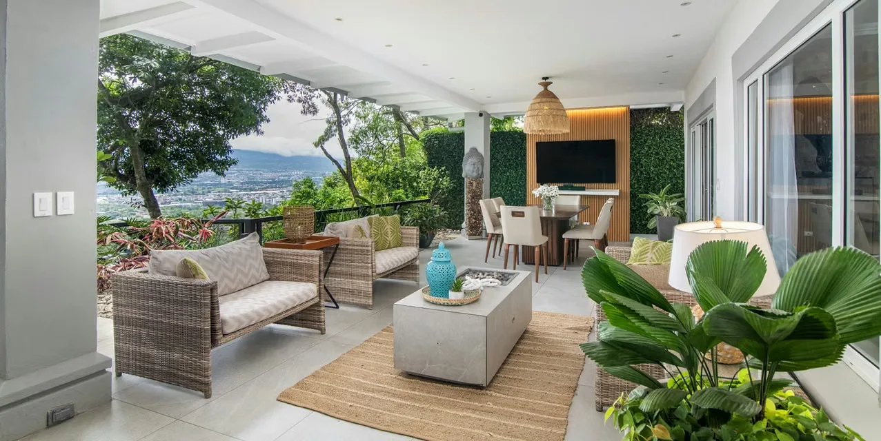 3-bedroom house in gated Escazú community with mountain views, spacious terraces, modern kitchen, and private garden near La Paco Shopping Center, Costa Rica.