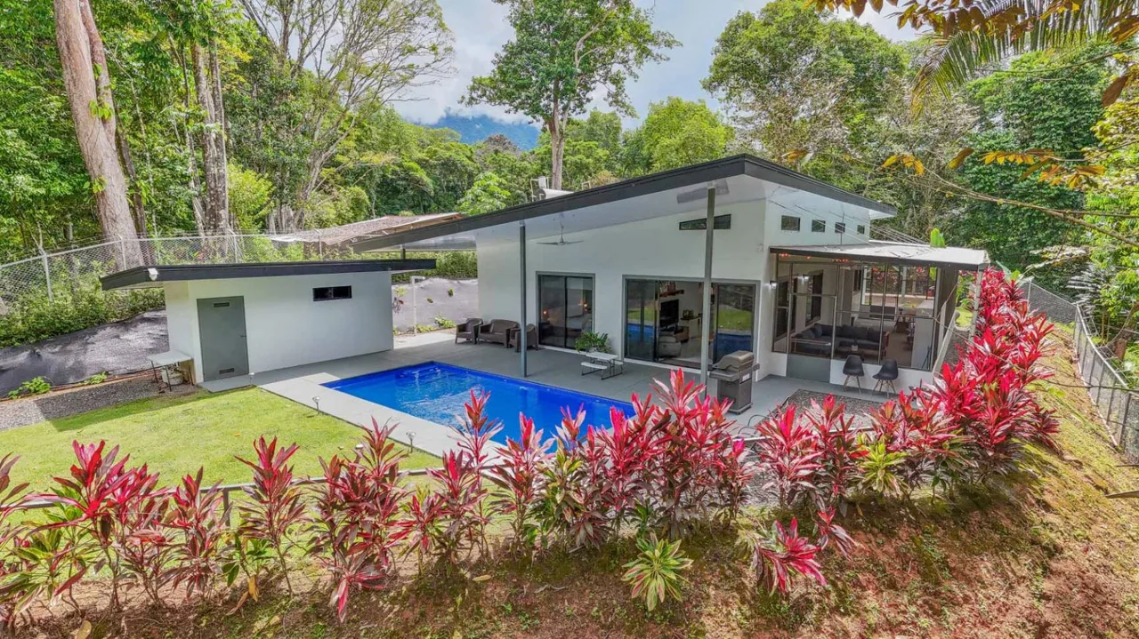 A bright &amp; modern 3-bed home offering TOTAL jungle emersion, a sunny elevated location, river frontage, a rainforest-backed